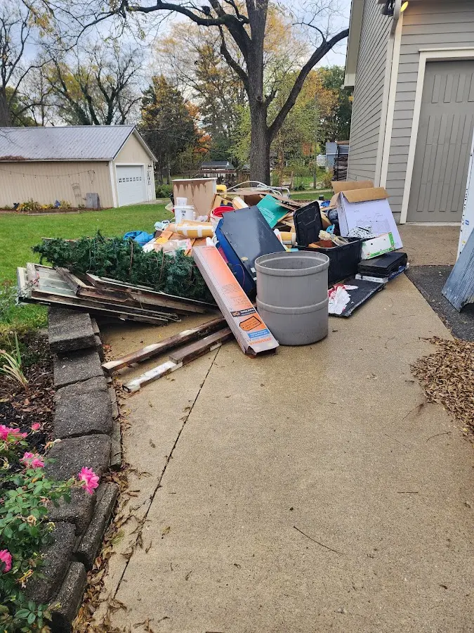 Dumpster being loaded with debris for Residential Dumpster Rental in Theodore